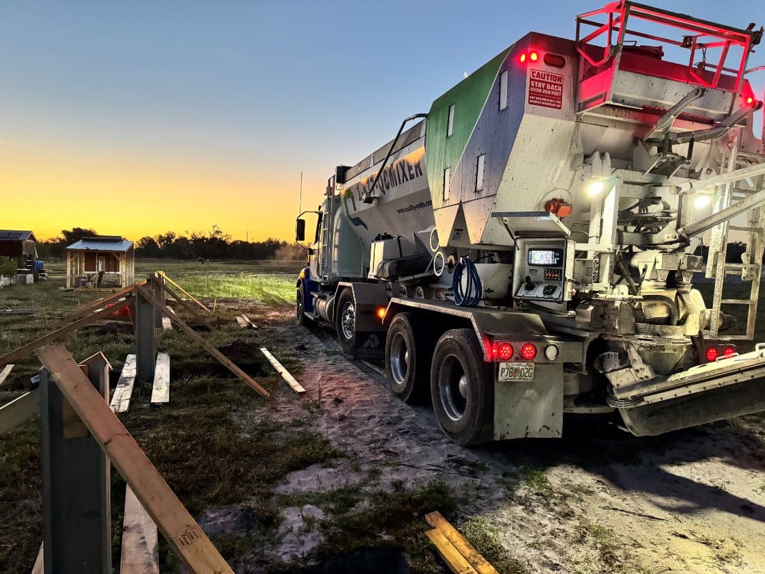 Quality-Crete volumetric mixer at sunset on a jobsite