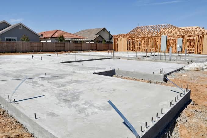 New home foundation slab poured in a residential subdivision under construction