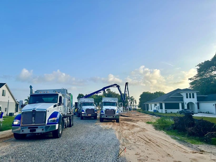 Quality-Crete mixer trucks on a residential street jobsite