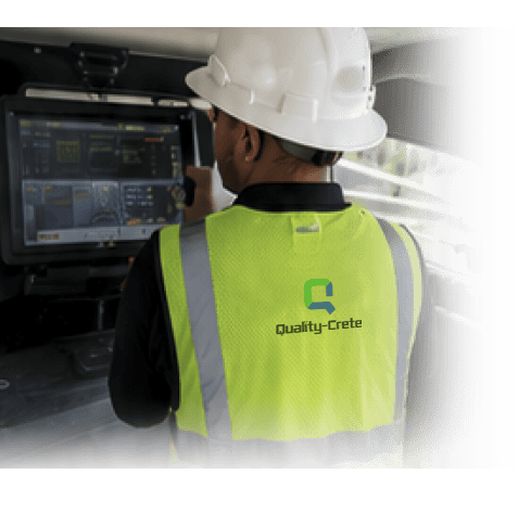 Quality-Crete operator monitoring production at the mixer control panel
