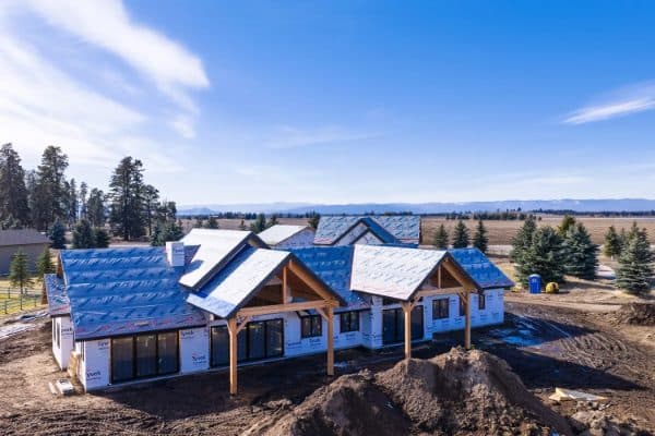 New custom home under construction on open land