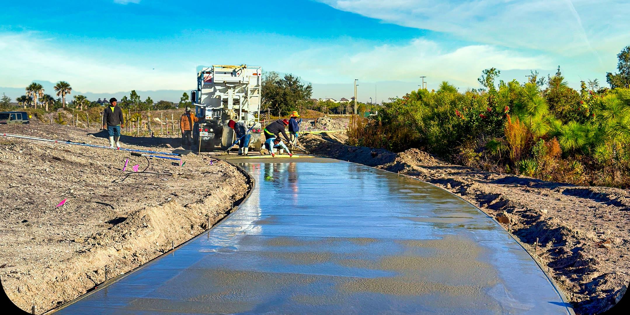 Volumetric mixer truck discharging fresh concrete on a jobsite