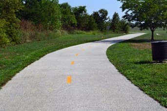 Pervious concrete trail through trees