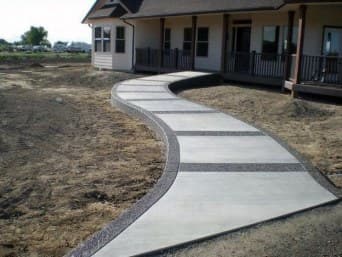 Pervious concrete walkway beside a building