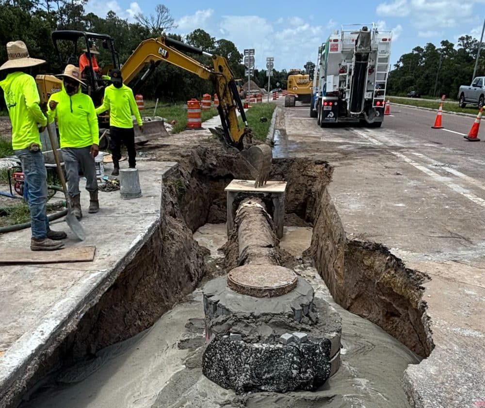 Crew working in an excavated utility trench